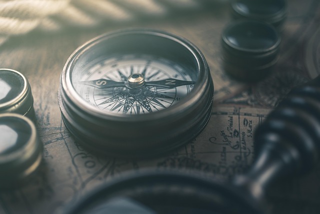 Vintage map and compass representing Voyage Vintage's story